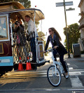 woman riding bicycle with jacket - tern bicycle